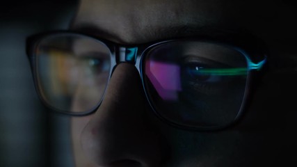 Man with Glasses Working in Office at Night