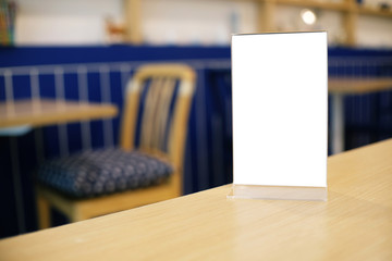 Menu frame standing on wood table in Bar restaurant cafe. space for text marketing promotion.