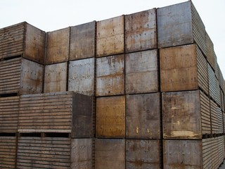 Big pile stack of wooden packing storage wooden crates boxes
