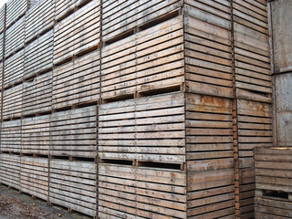 Big pile stack of wooden packing storage wooden crates boxes