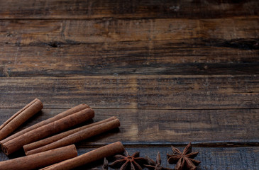 Star anise with cinnamon and on dark wooden background