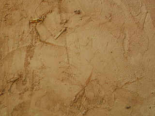 Wall made of clay and sand,brown concrete floor background