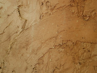 Wall made of clay and sand,brown concrete floor background