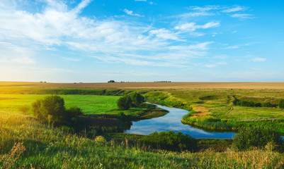Sunny summer landscape with fields,river bend and beautiful woods.