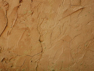 Wall made of clay and sand,brown concrete floor background
