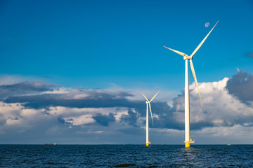 windmiil park in ocean, windmill farm rainy clouds