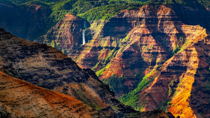 Landscape detail of beautiful Waimea canyon colorful cliffs and waterfall, Kauai, Hawaii - 230094292
