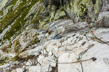 Metal steps, ladders and chains or facilitations on the trail leading to Rysy peak, Slovakia.