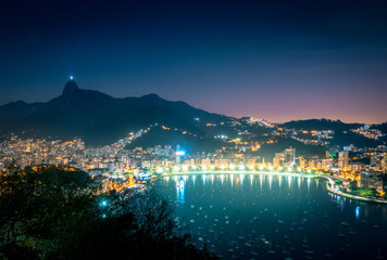 Fototapeta na wymiar Aerial view of Rio de Janeiro and Guanabara Bay with Corcovado Mountain at night - Rio de Janeiro, Brazil