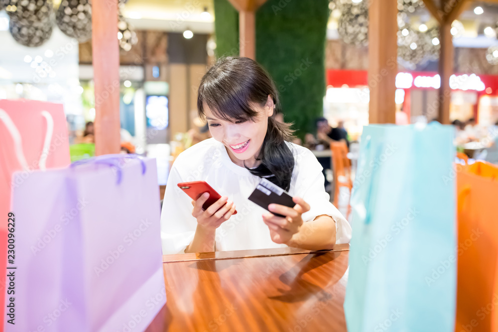 Poster woman use phone and card