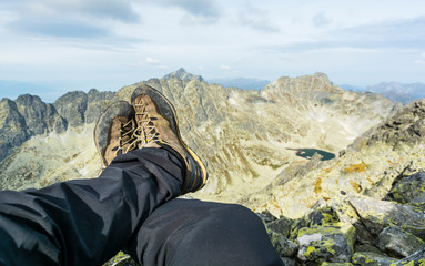 Shoes approach on the background of mountains.