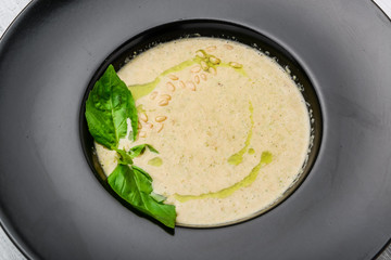 mushroom cream soup on white wooden board