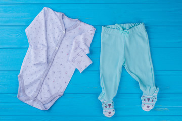 Baby sleepwear onesie pajama and footed pants.