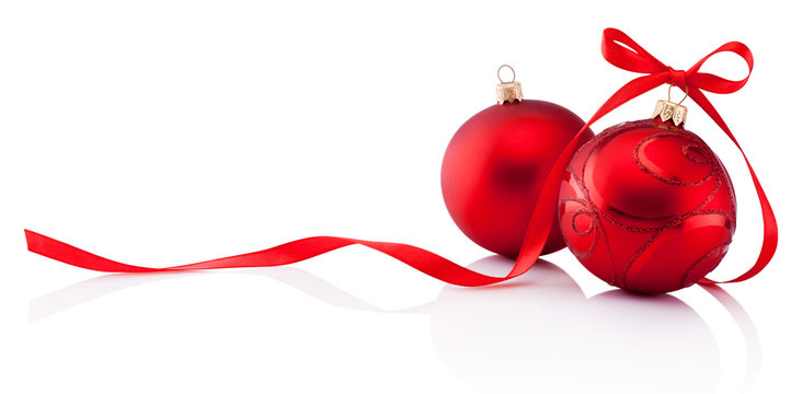 Two red Christmas decoration baubles with ribbon bow isolated on white background