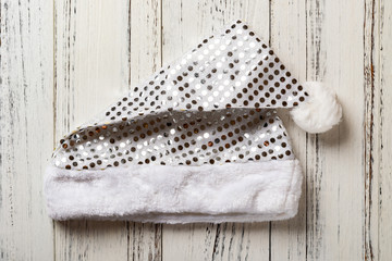 white Santa Claus hat on white wood background