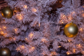 Christmas tree with yellow balls.