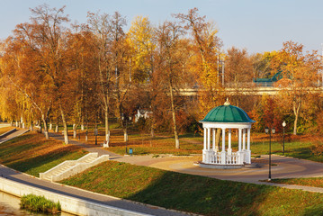 Morning autumn landscape in city park. Gazebo and the river Orlik. Russia, city of Oryol