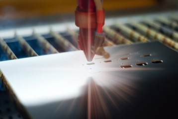 stage of production of printed circuit boards - laser cutting in automatic mode, close-up, blurred...