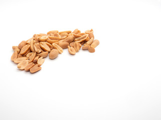 salted peanuts on white background