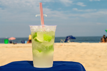Glass with caipirinha on the beach of Copacabana (Rio de Janeiro, Brazil)