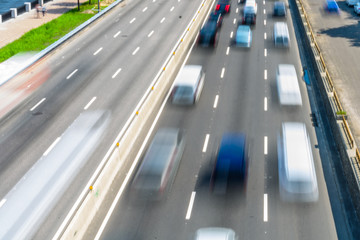 Abstract and blurred background of the many cars in street. Blurred motion