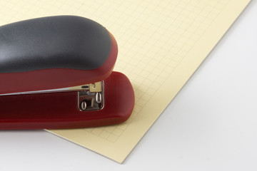 stapler for stapling papers on a table