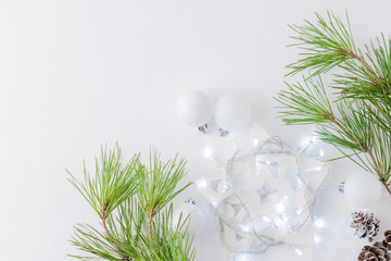 Holiday composition with pine branches and a garland