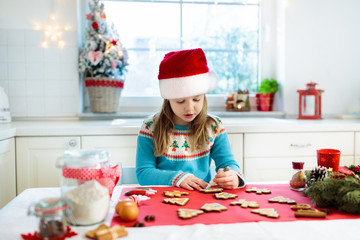 Kids bake Christmas cookies. Child cook for Xmas.
