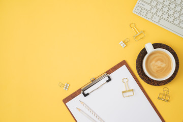 Fototapeta premium Office desk or home office table background with coffee cup and computer keyboard