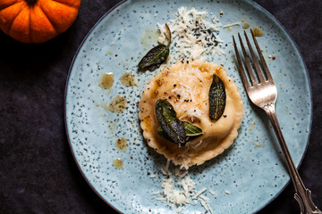 Pumpkin and ricotta ravioli with crispy sage, burnt butter sauce and parmesan