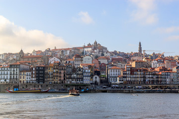 Fototapeta na wymiar View of the Ribera from the opposite riverside of the river Douro, Porto, Portugal. Colorful houses of old town on the embankment.