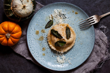 Pumpkin and ricotta ravioli with crispy sage, burnt butter sauce and parmesan