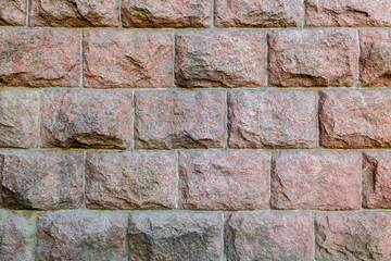 Texture wall of huge granite blocks. Strength and strength.