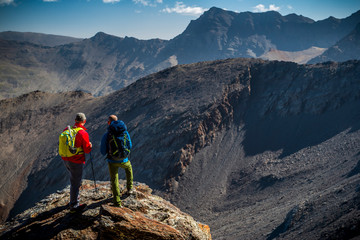 Anonymous men admiring view of mountains