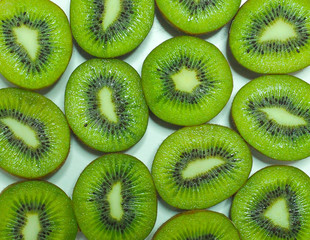 Fototapeta premium Green kiwi sliced background