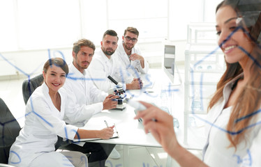 Fototapeta premium female scientist makes a report to colleagues