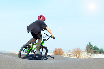 Boy in bike helmet on bmx track © Aaron Weiss
