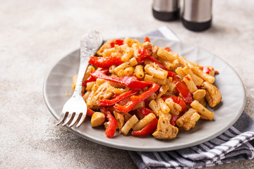 Pasta with chicken and pepper in tomato sauce
