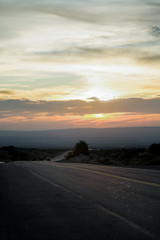  Car on Andes mountain road to the UCO valley at sunrise in Mendoza Argentina 