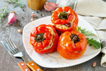 Stuffed Pepper with Rice, Tomatoes and Beans on a stone or concrete background. Vegetarian Healthy Food.