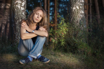Naklejka premium young woman at the birch