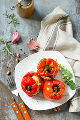 Stuffed Pepper with Rice, Tomatoes and Beans on a stone or concrete background. Vegetarian Healthy Food.