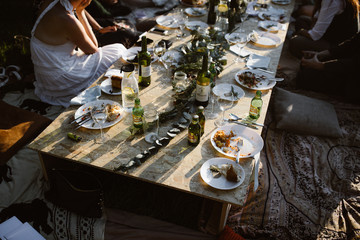 people eating at a floor table