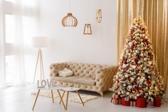 Christmas living room interior with a big Christmas tree
