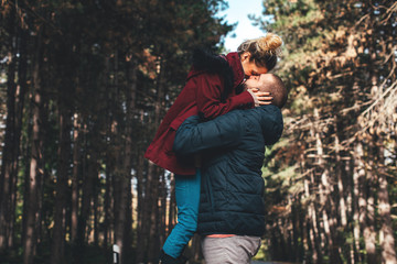 Young hipster couple in love with in the forest