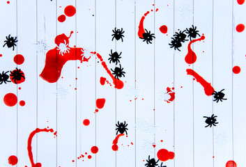 Spiders on a white background covered with blood, Halloween.