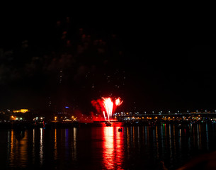 The beginning of the fireworks from the barge on the Volga river to the day of Kostroma