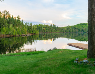 Fototapeta na wymiar Late Afternoon Sky Reflected on Lake