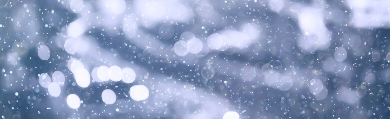 blurred bokeh city background / glare and glowing light in night city, modern beautiful bright background