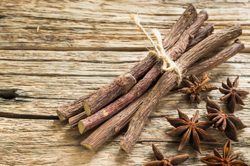 licorice root and anise on the table - Glycyrrhiza glabra